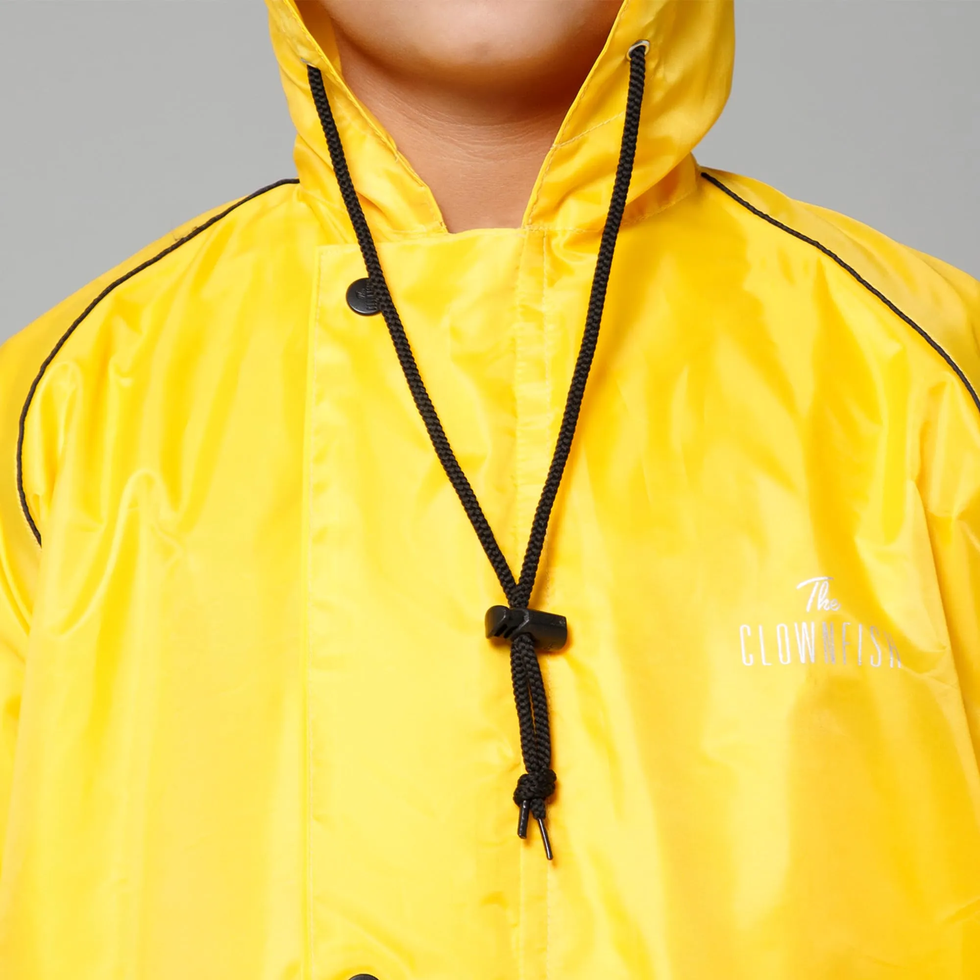 THE CLOWNFISH Duke Series Kids Waterproof Polyester Double Coating Reversible Raincoat with Hood and Reflector Logo at Back. Set of Top and Bottom. Printed Plastic Pouch. Kid Age-11-13 years (Yellow)