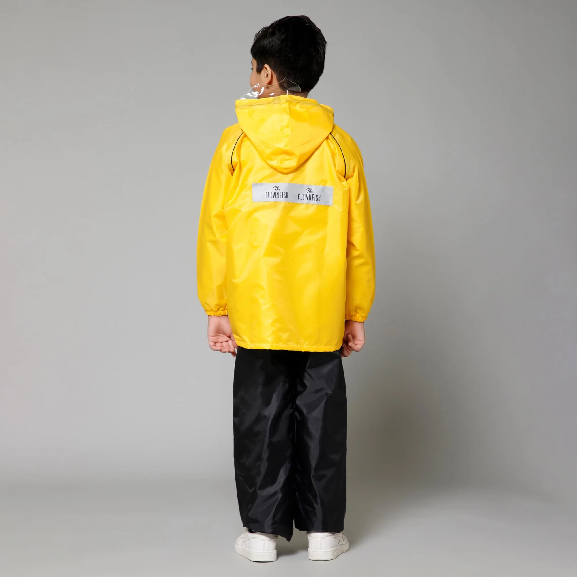 THE CLOWNFISH Duke Series Kids Waterproof Polyester Double Coating Reversible Raincoat with Hood and Reflector Logo at Back. Set of Top and Bottom. Printed Plastic Pouch. Kid Age-11-13 years (Yellow)
