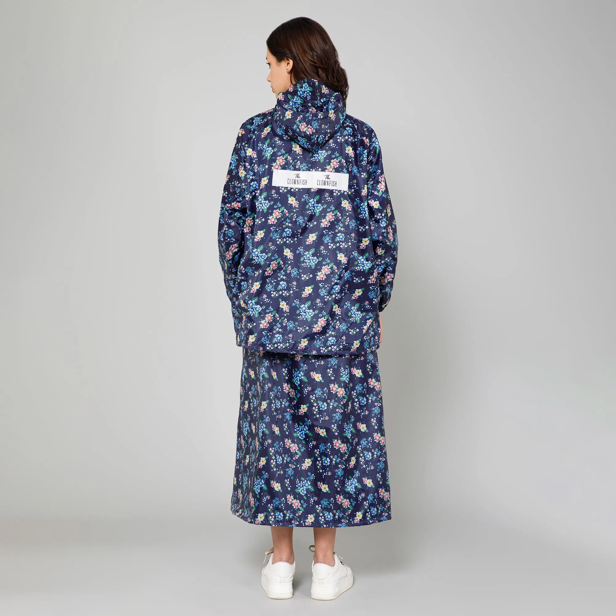 THE CLOWNFISH Polyester Waterproof Rain Coat For Women Skirt and Top Raincoat With Adjustable Hood and Front Pockets Rain Glam Series (Dark Blue Floral, X-Large)